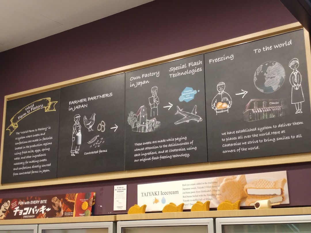 An informational display board detailing Châteraisé's 'Farm to Factory' process and product quality.