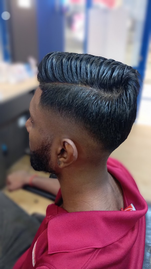 Close-up of a man's fresh haircut featuring a clean fade and styled top.