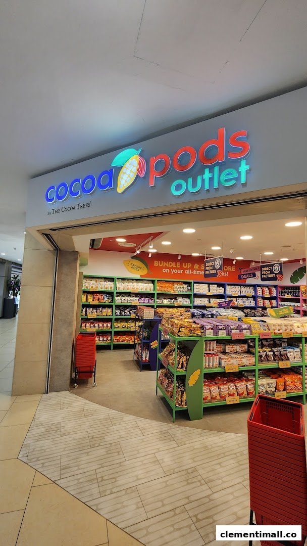 The vibrant entrance of Cocoa Pods by The Cocoa Trees outlet, showcasing a wide array of confectionery.