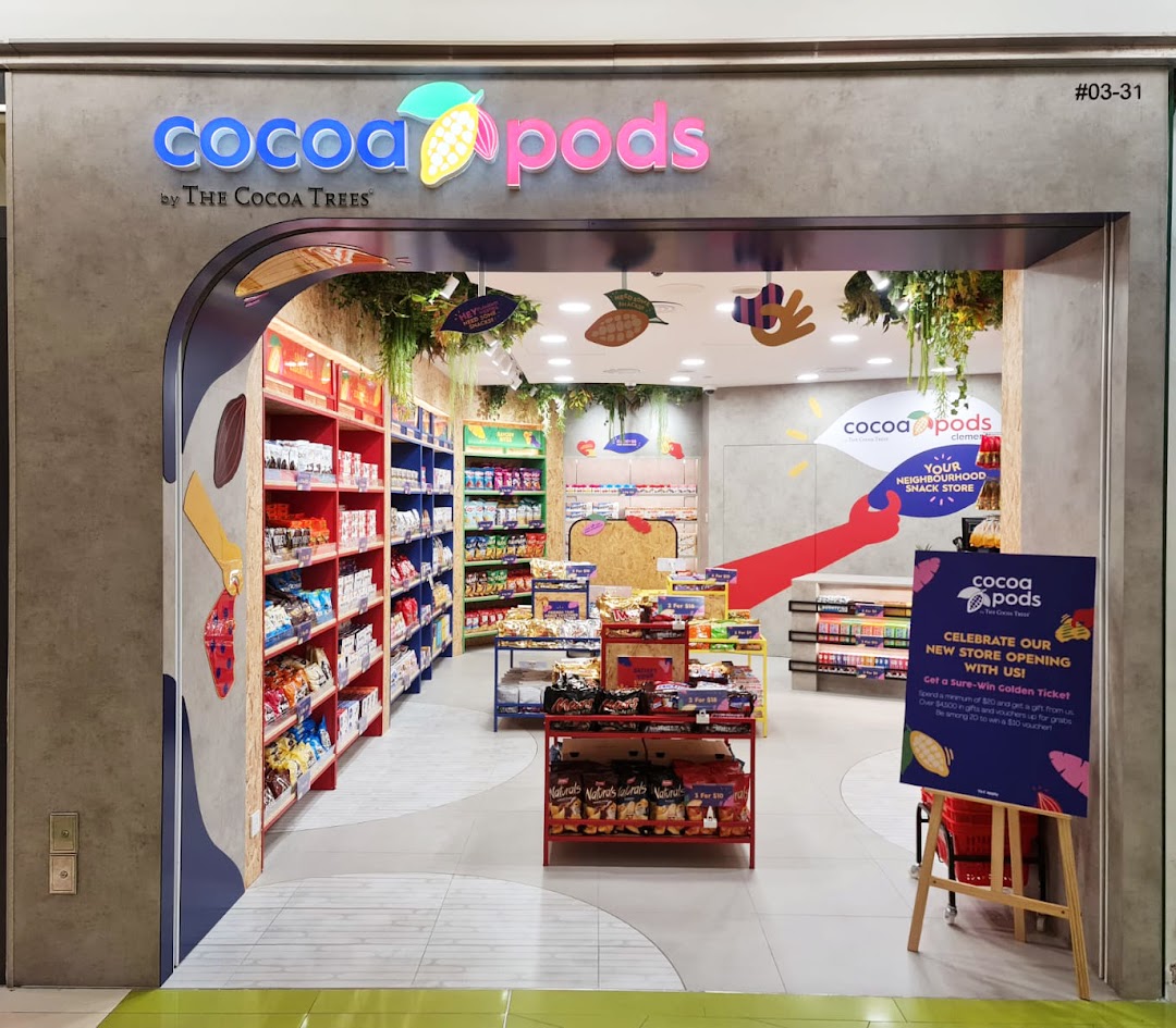 The vibrant entrance of Cocoa Pods by The Cocoa Trees, showcasing its colorful interior and snack offerings.