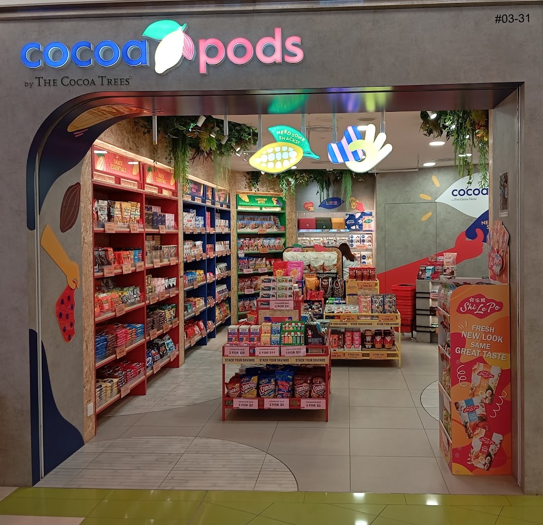 The vibrant entrance of Cocoa Pods by The Cocoa Trees, showcasing a wide array of snacks.