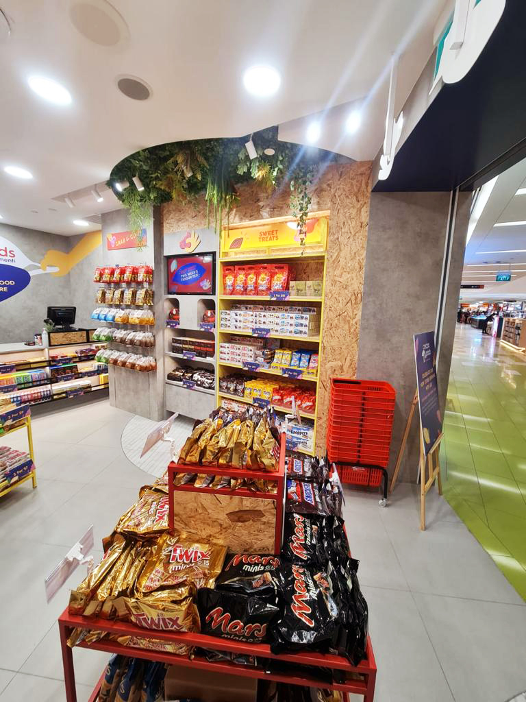 Interior view of Cocoa Pods by The Cocoa Trees, showcasing a wide array of chocolates and sweet treats.