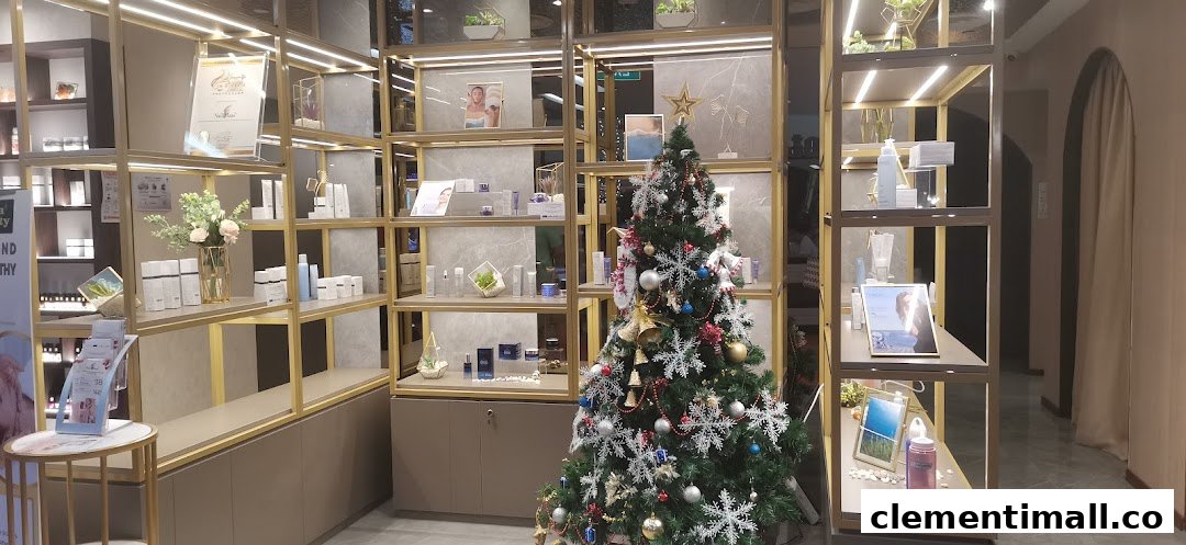An interior view of Donna Beauty, showcasing skincare products on illuminated shelves and a festive Christmas tree.
