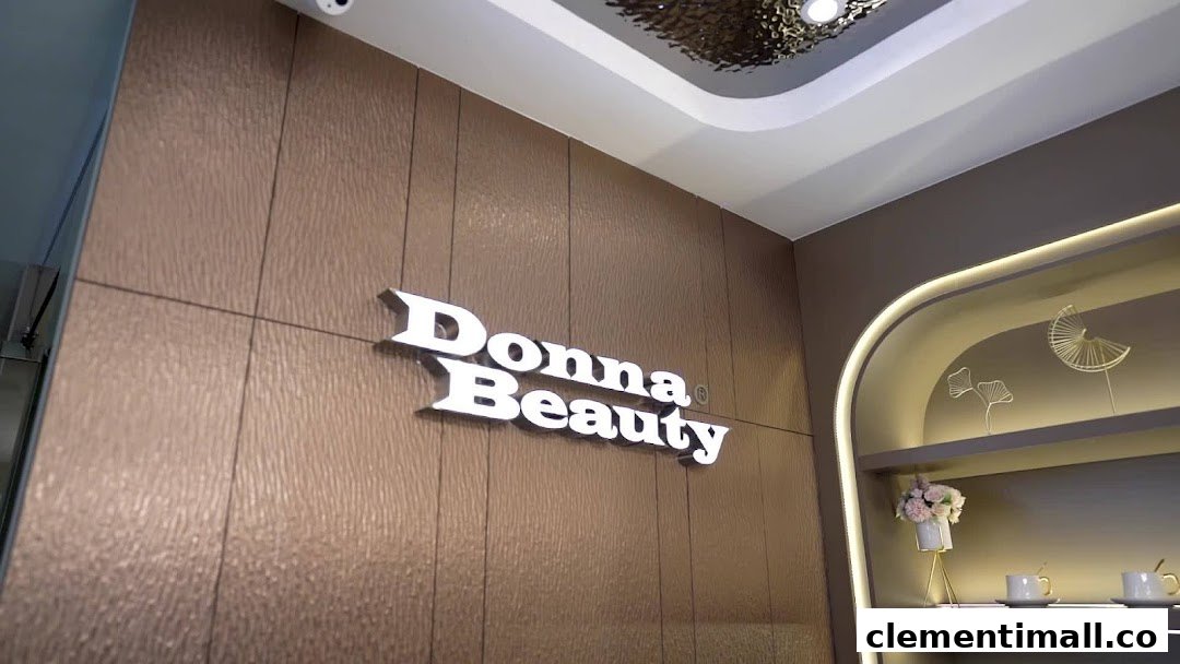Interior view of Donna Beauty featuring its illuminated logo on a textured wall and decorative shelving.