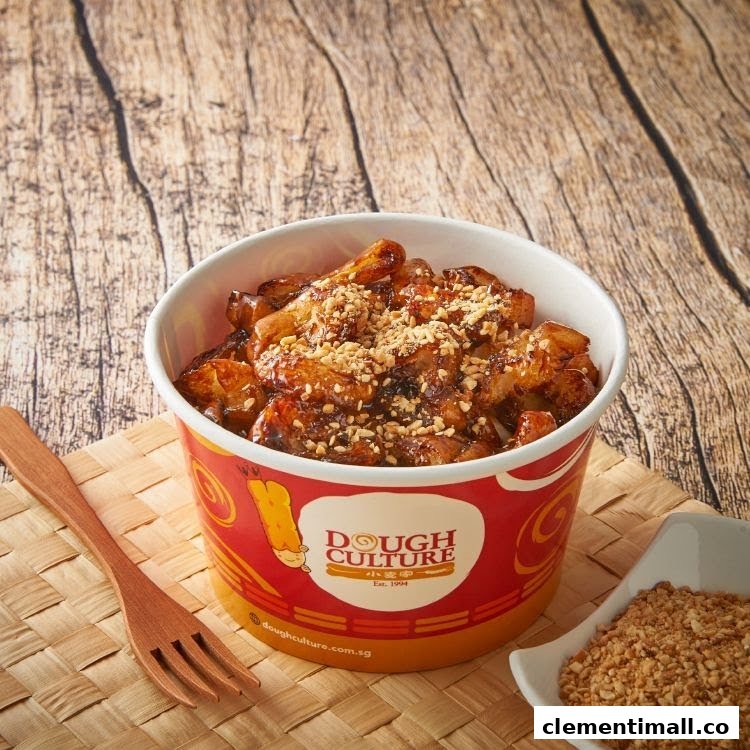 A delicious cup of Dough Culture's signature fried snack, topped with crunchy peanuts, ready to be enjoyed.