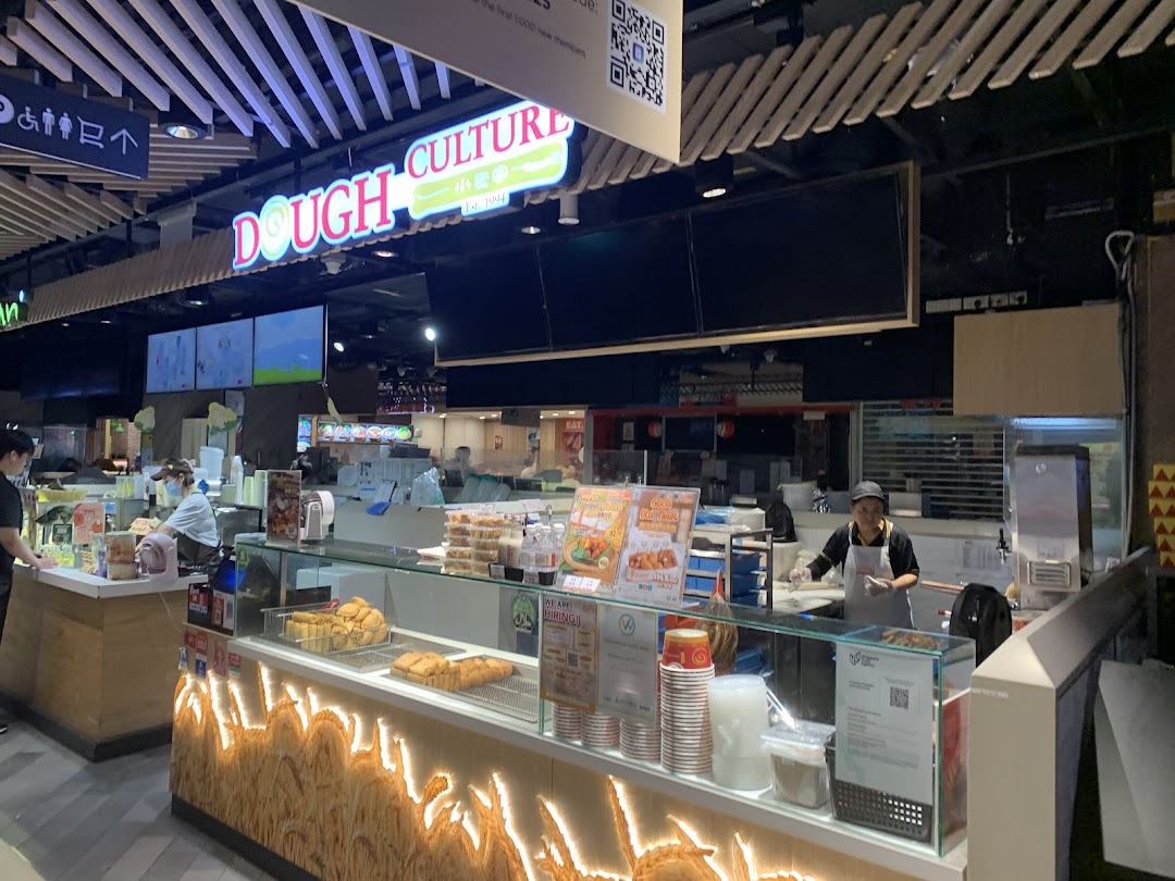 Dough Culture stall with staff preparing and displaying traditional fried dough snacks and beverages.