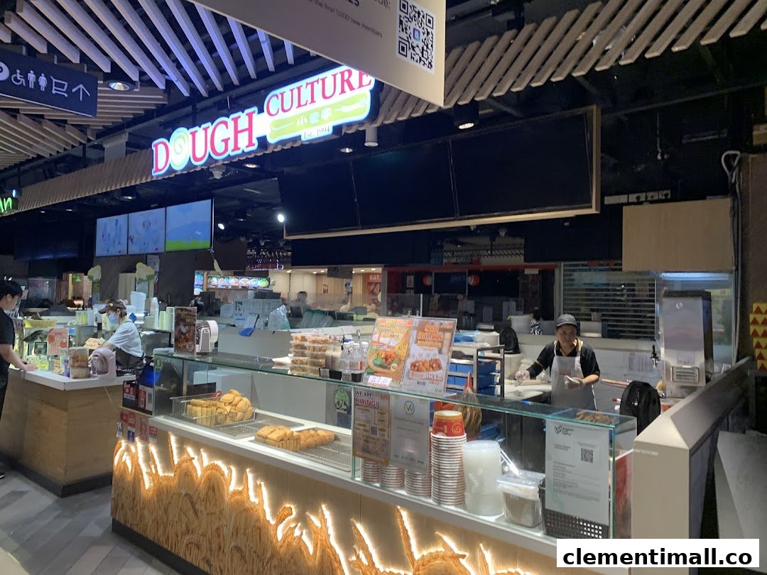 Dough Culture stall with staff preparing and displaying traditional fried dough snacks and beverages.