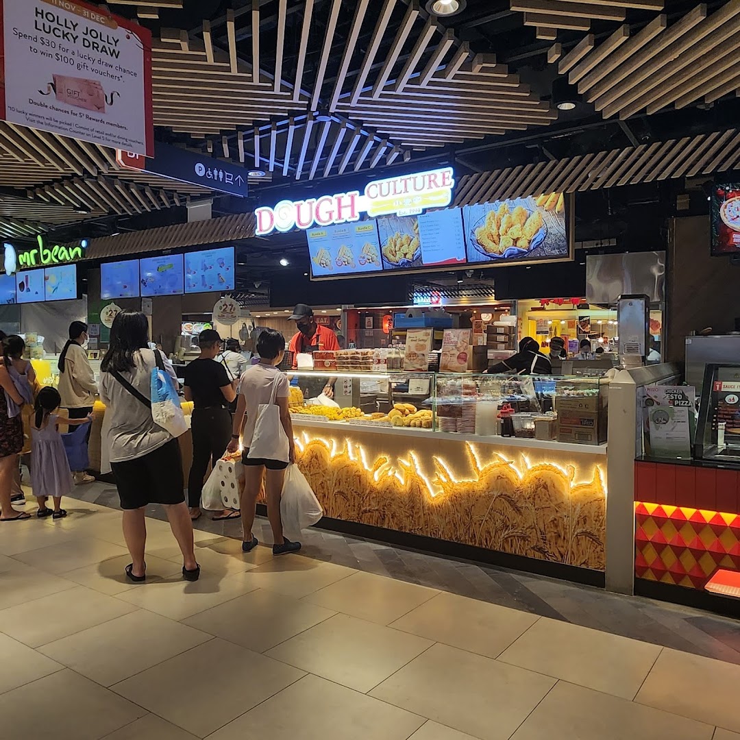 Customers queueing at the Dough Culture stall, showcasing its popular fried dough products in a bustling mall setting.