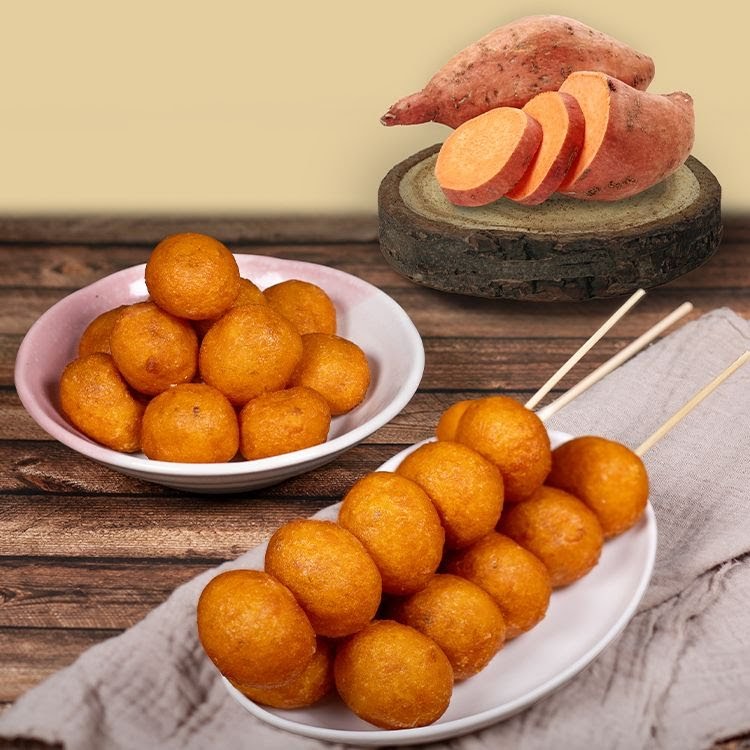 Golden sweet potato balls served in a bowl and on skewers, with fresh sweet potatoes.