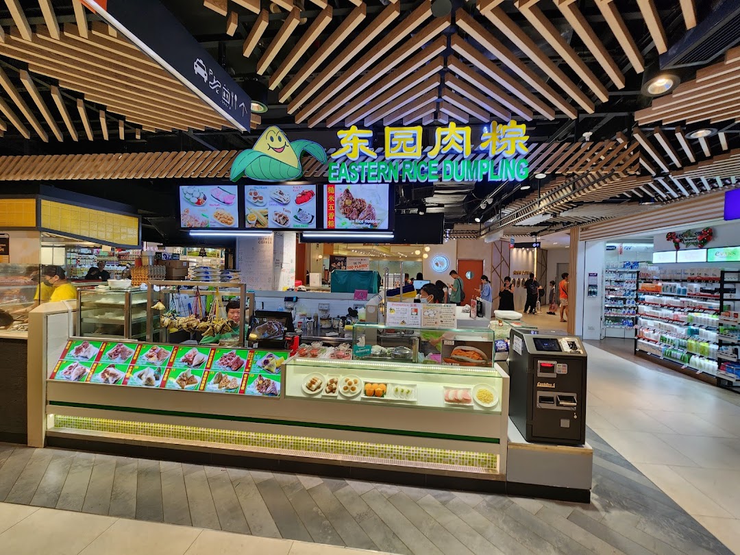 A vibrant view of Eastern Rice Dumpling shop's counter, showcasing a variety of traditional rice dumplings and snacks.