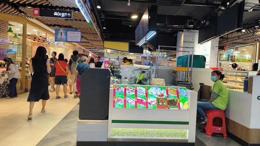 A bustling food stall named Eastern Rice Dumpling in a mall, showcasing various delicious dishes.