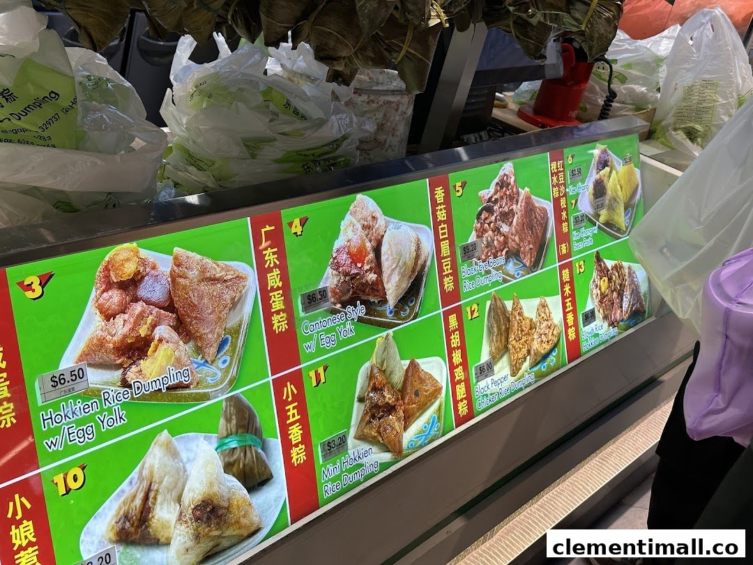A display case showcasing various rice dumplings with prices and descriptions.