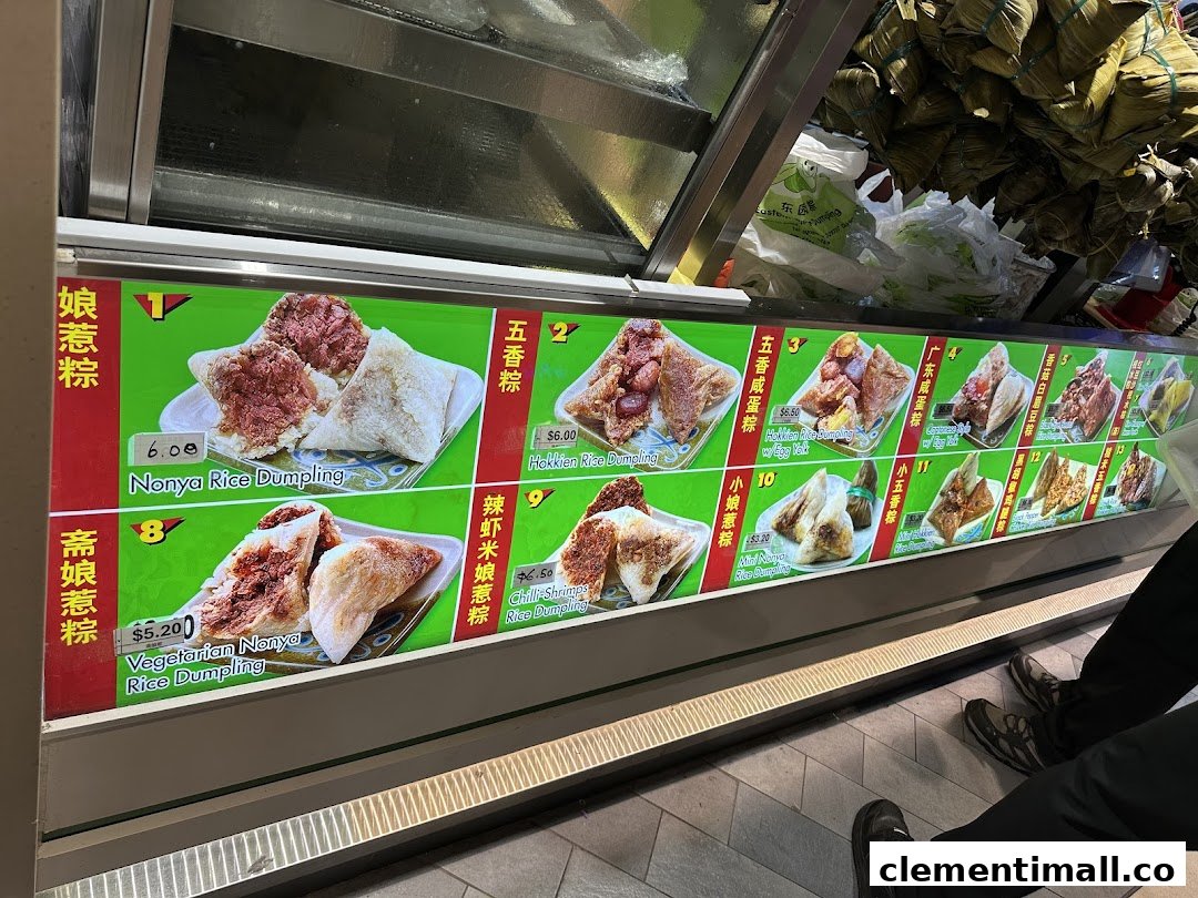 A vibrant display of various traditional rice dumplings with prices and descriptions at Eastern Rice Dumpling.