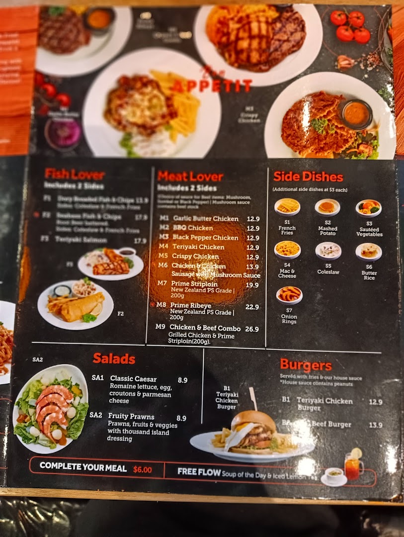 A detailed menu displaying various Western dishes including meats, fish, salads, and burgers.
