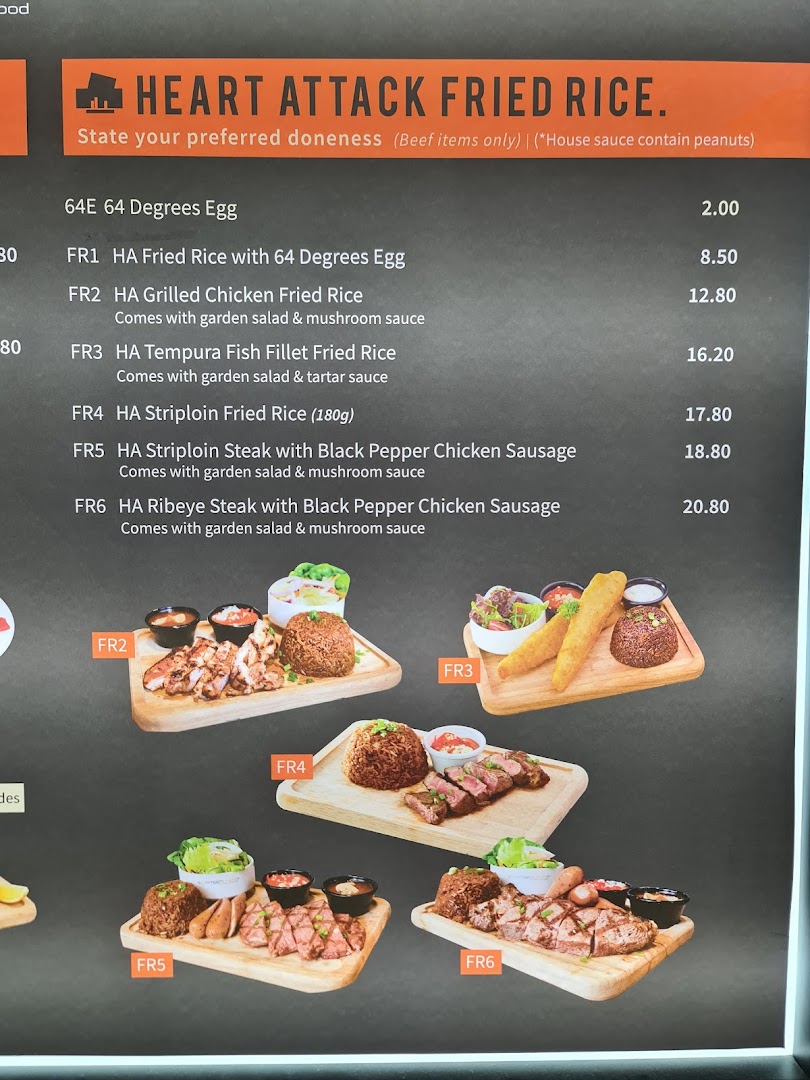 A menu board displaying 'Heart Attack Fried Rice' dishes with prices and accompanying images.