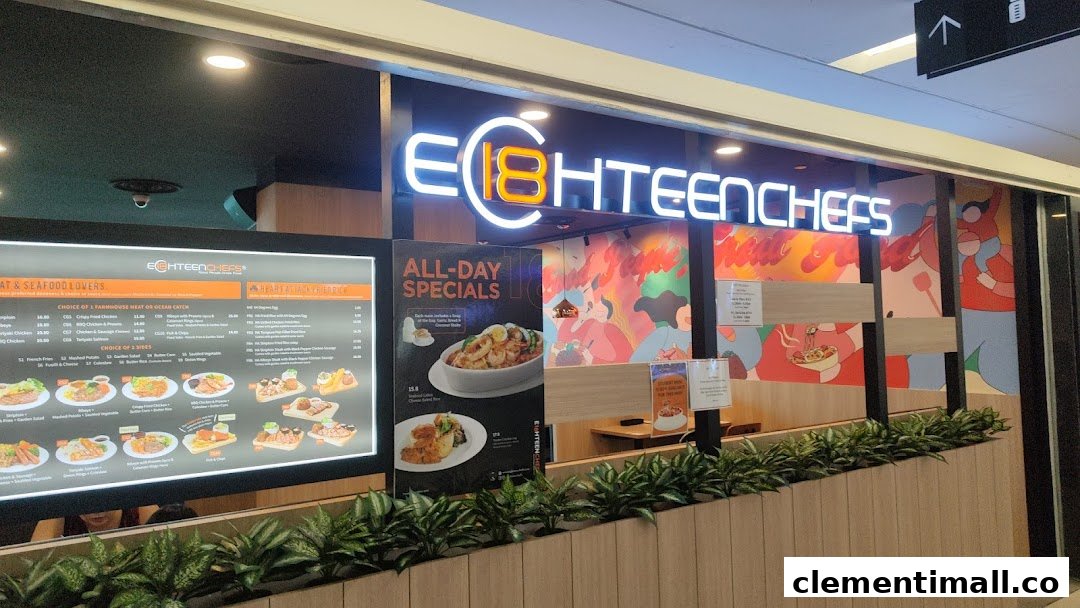 The brightly lit exterior of Eighteen Chefs restaurant, featuring its logo, menu displays, and colorful wall art.
