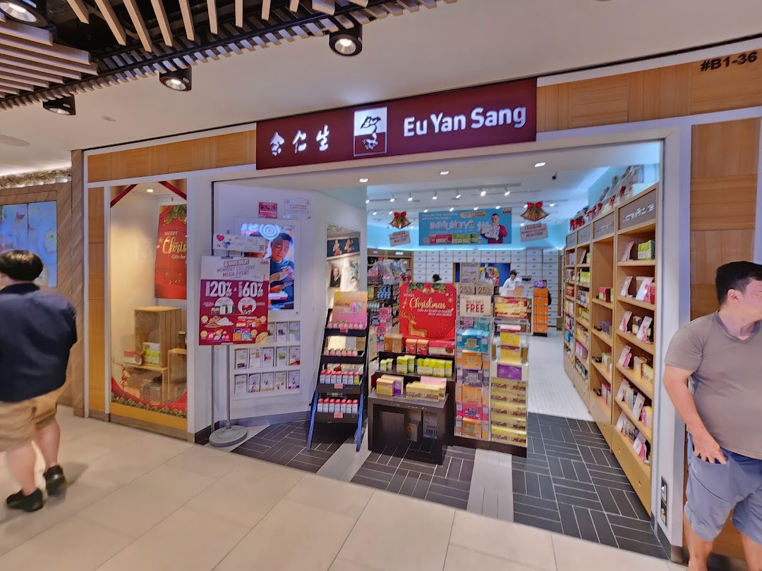 The storefront of Eu Yan Sang, featuring its entrance, interior view, and promotional displays.