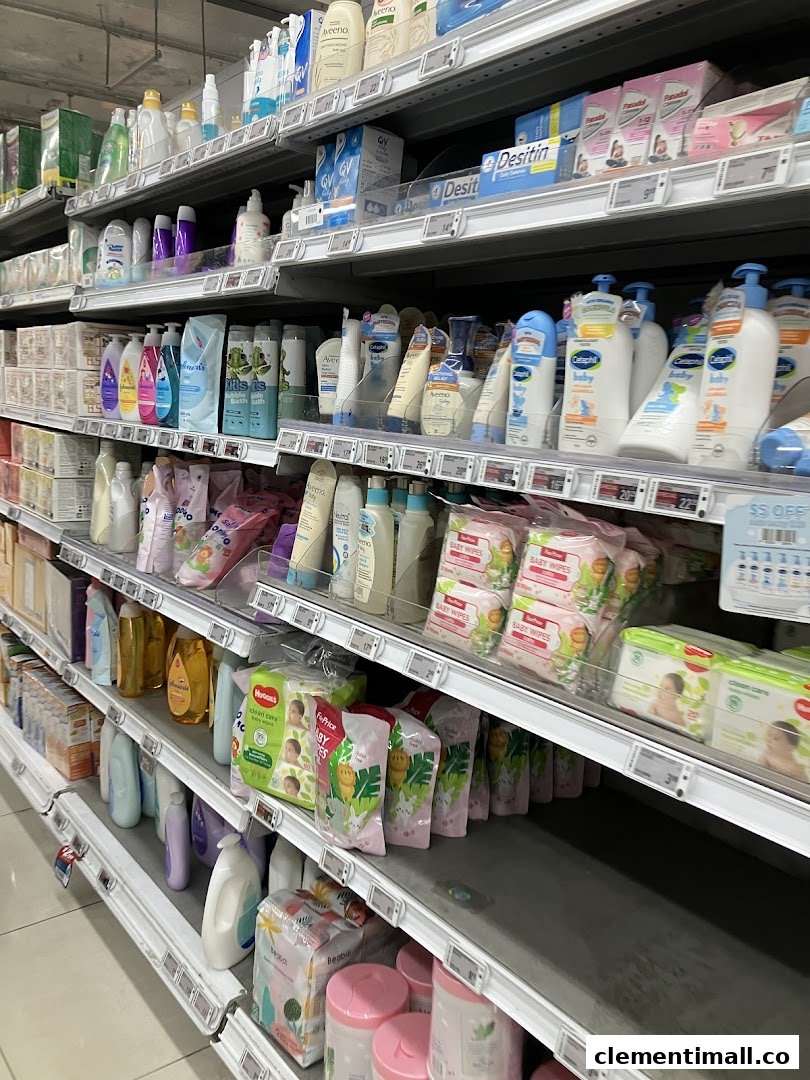 A well-stocked aisle at FairPrice Finest featuring baby care products, toiletries, and health essentials.