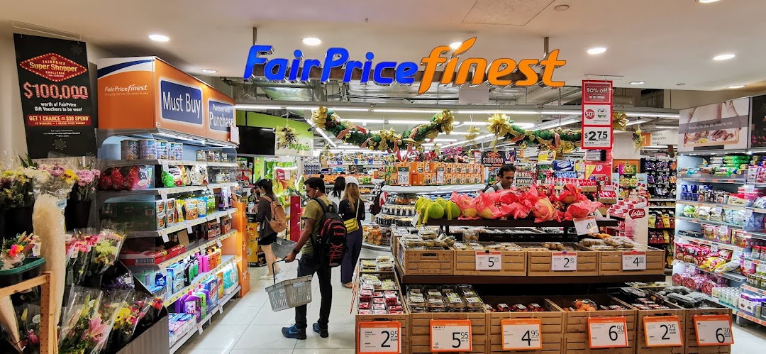 A bustling interior view of FairPrice Finest supermarket with shoppers, fresh produce, and various products.