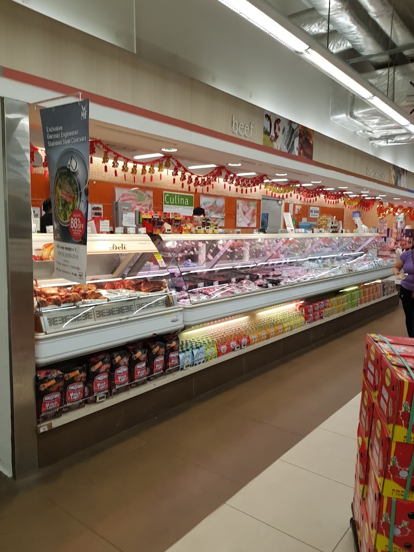 A vibrant fresh meat and deli counter at FairPrice Finest, adorned with festive decorations.