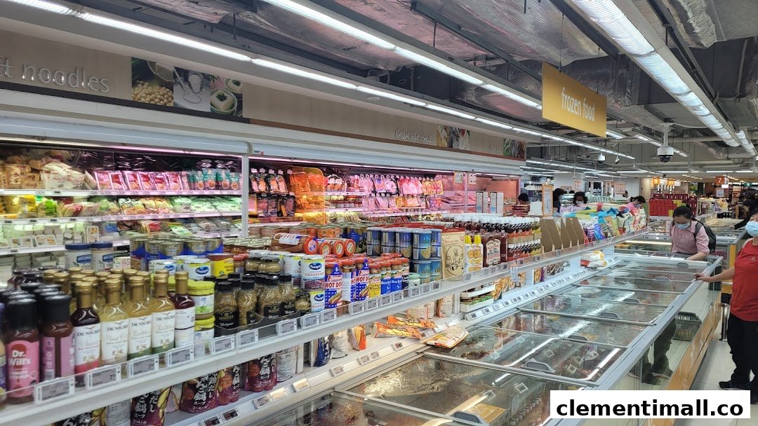 A bustling supermarket aisle at FairPrice Finest, featuring diverse groceries, fresh produce, and frozen foods.