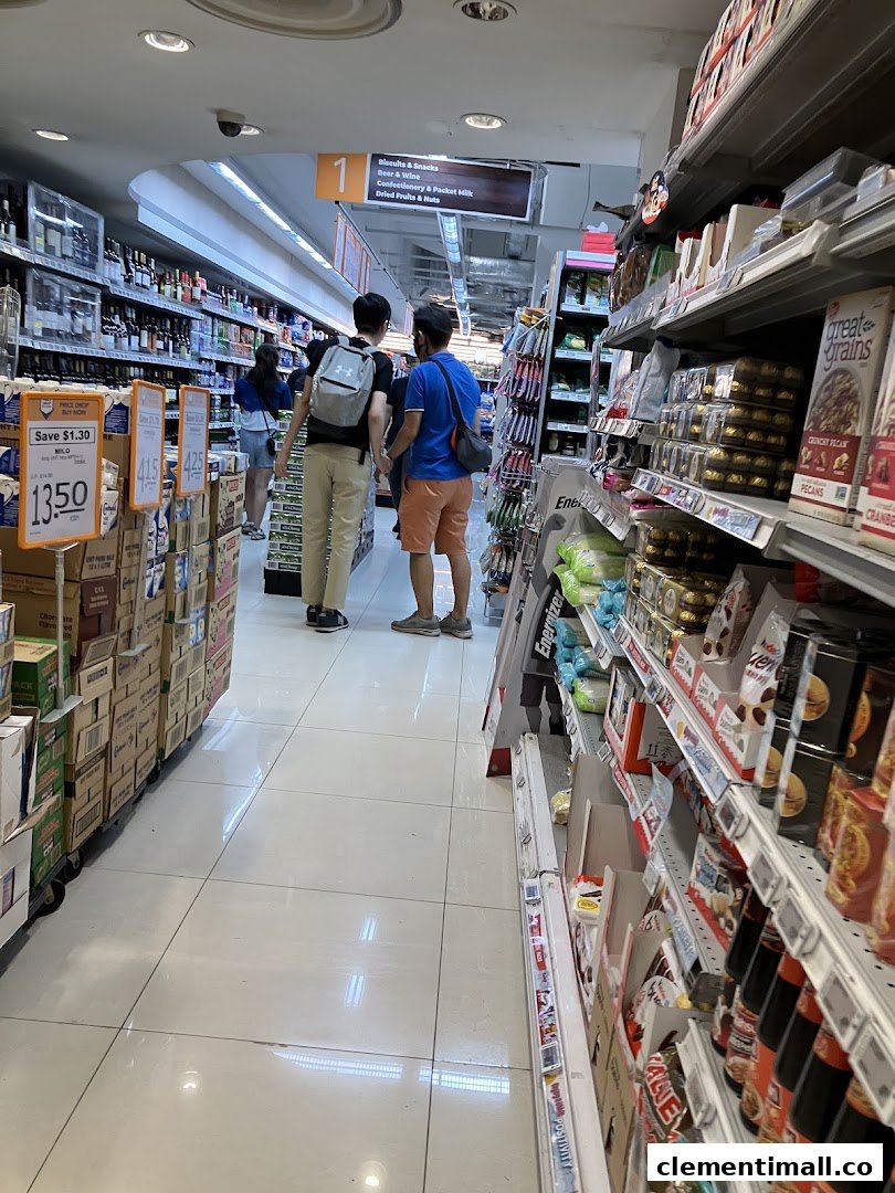 Shoppers browse well-stocked aisles at FairPrice Finest, featuring a wide array of groceries.