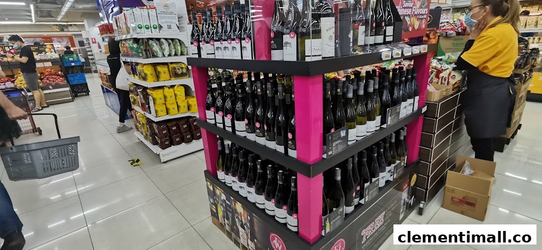 An interior view of FairPrice Finest, showcasing a prominent wine display, fresh produce, and shoppers.