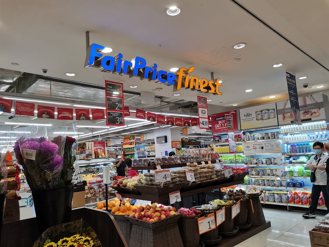Interior of FairPrice Finest supermarket, featuring fresh produce, baked goods, and groceries.