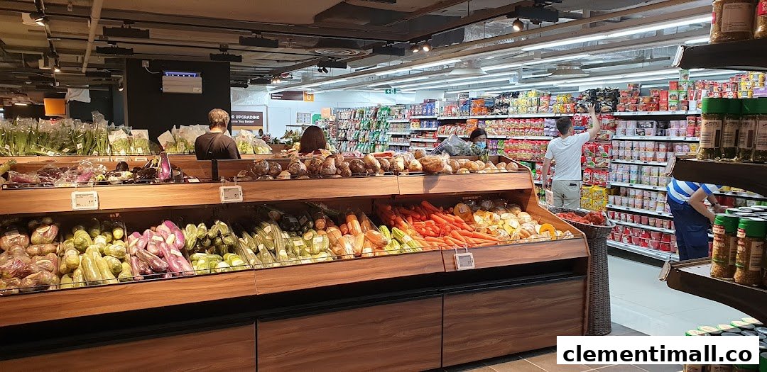 An interior view of FairPrice Finest supermarket, showcasing fresh produce and grocery aisles with shoppers.