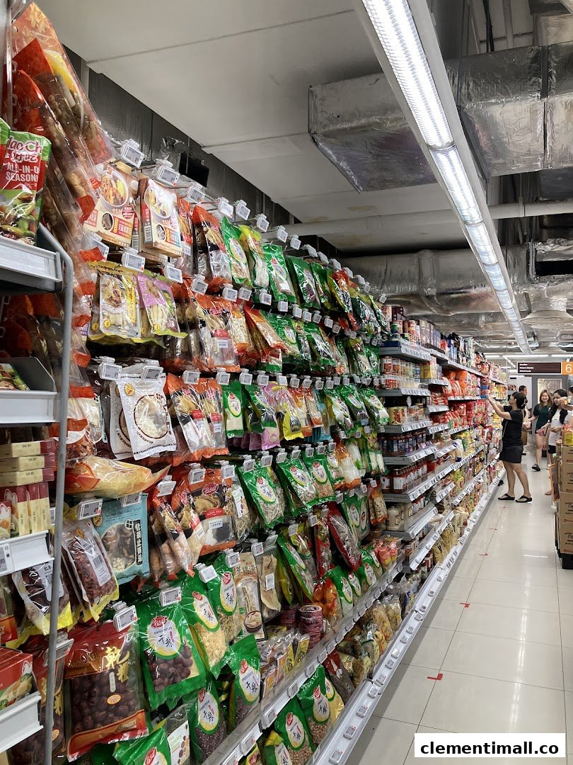 An aisle in FairPrice Finest supermarket, showcasing a wide variety of packaged food items.