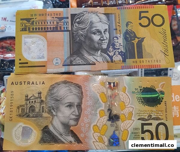 Close-up of two Australian 50 dollar banknotes, showing front and back designs.