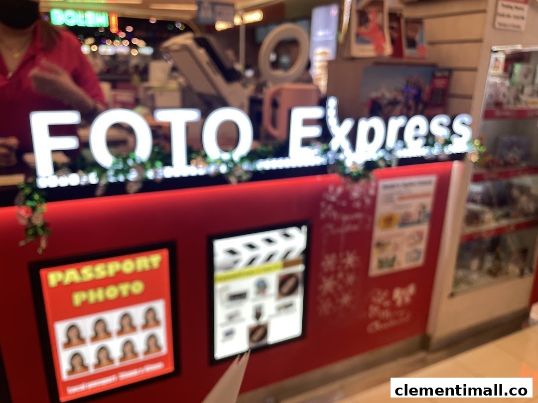 The service counter of Foto Express, featuring its illuminated sign and displays for photo services.