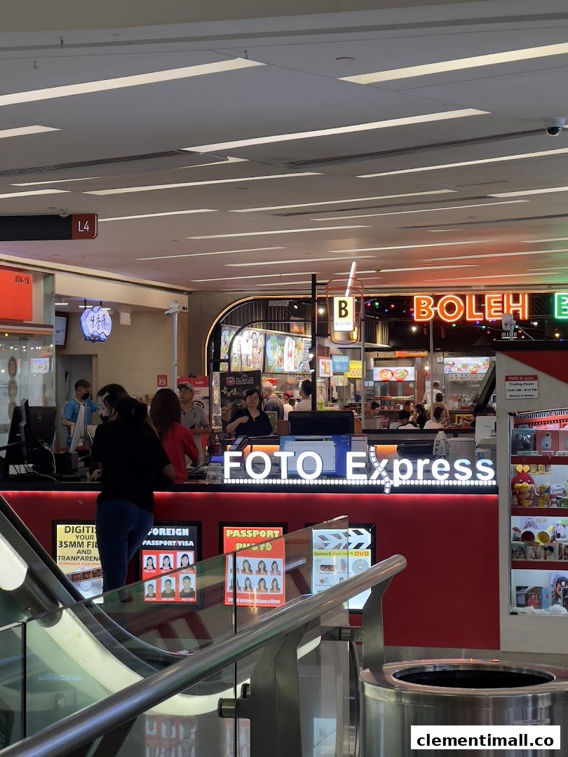 Customers at the Foto Express counter, offering photo printing, passport photos, and digitization services.