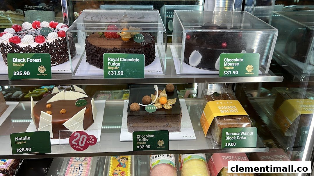 A vibrant display case showcasing a variety of delicious cakes and pastries with price tags.
