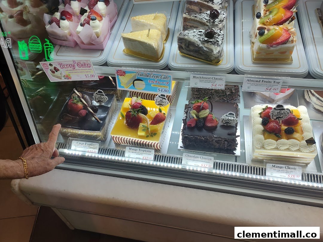 A vibrant display case showcasing a variety of beautifully decorated cakes and pastries.