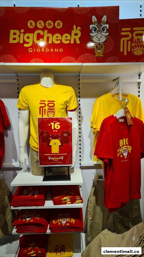 A vibrant retail display at Giordano showcasing their 'Big Cheer' collection of red and yellow festive apparel.