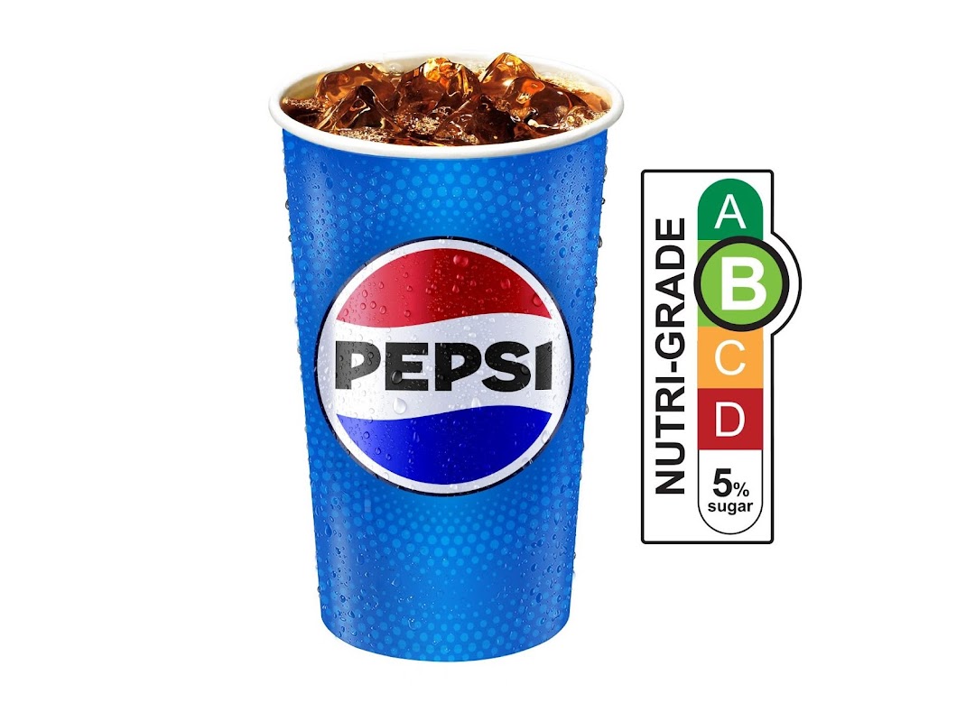 A refreshing Pepsi drink in a blue cup with ice and a Nutri-Grade B label.