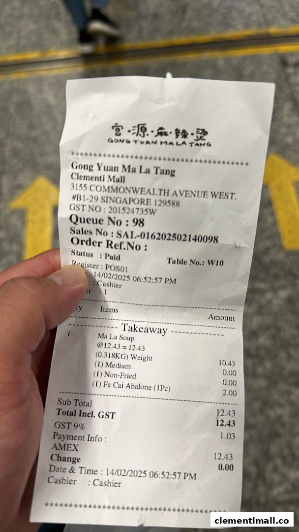 A close-up of a receipt from Gong Yuan Ma La Tang showing a takeaway order for Ma La Soup and Fa Cai Abalone.