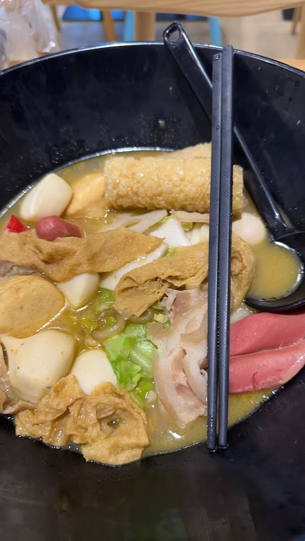 A close-up of a delicious bowl of Mala Tang, brimming with assorted ingredients and a rich broth.