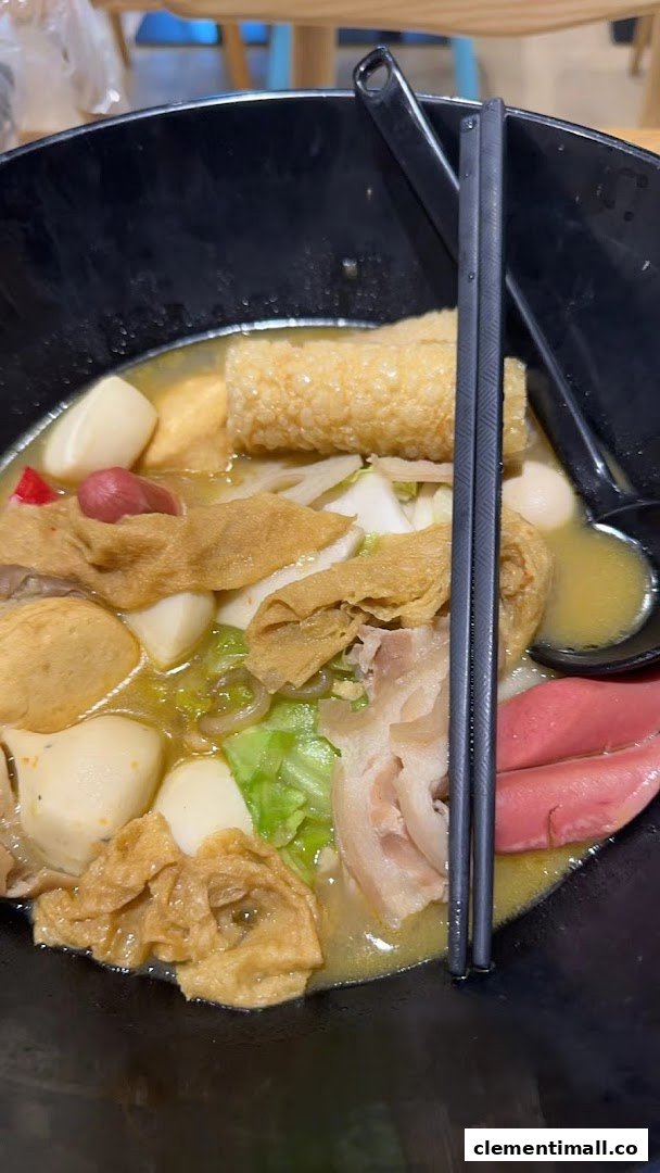 A close-up of a delicious bowl of Mala Tang, brimming with assorted ingredients and a rich broth.