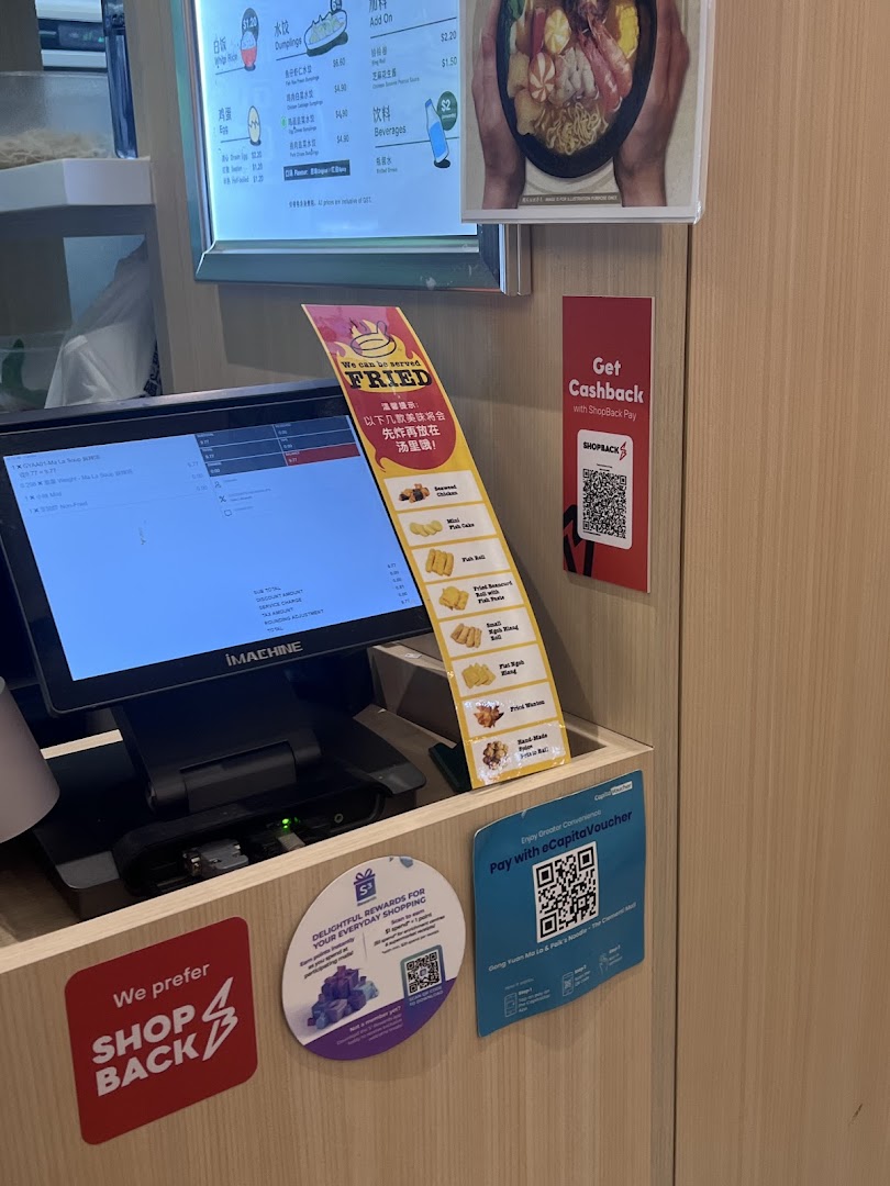 A counter area displaying menu items, payment options, and a special fried items list.