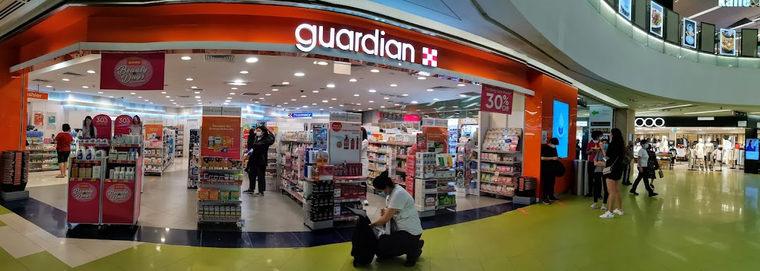 The Guardian Health & Beauty pharmacy entrance at Clementi Mall, showcasing various health and beauty products.