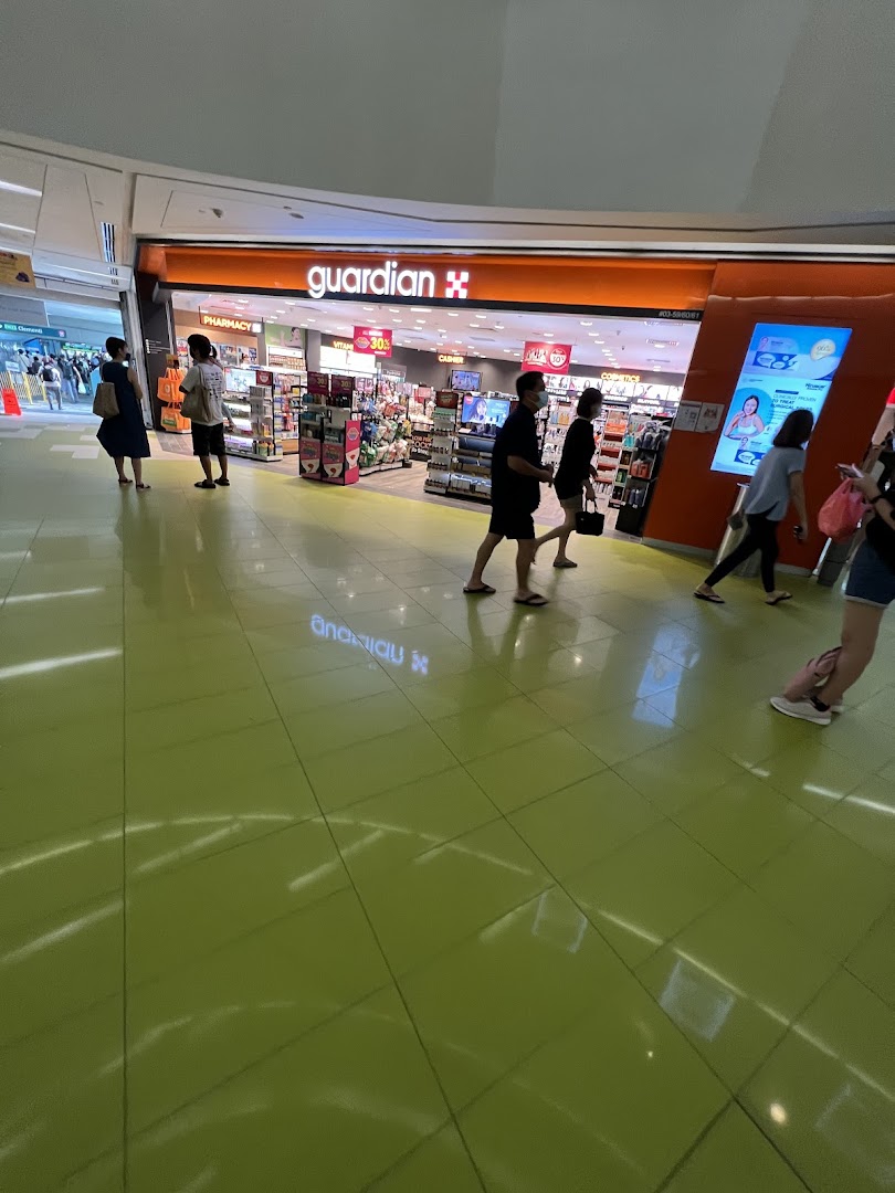 The Guardian Health & Beauty shop entrance with shoppers walking past in Clementi Mall.