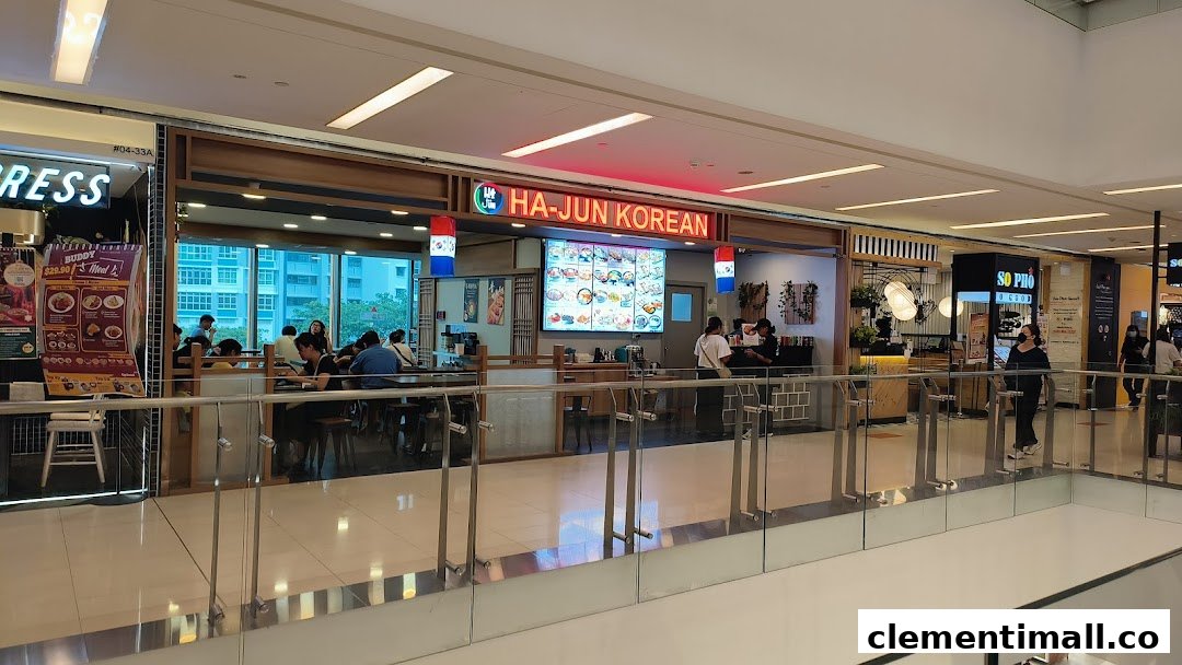 The storefront of Ha-Jun Korean restaurant, showing its entrance and customers dining inside.