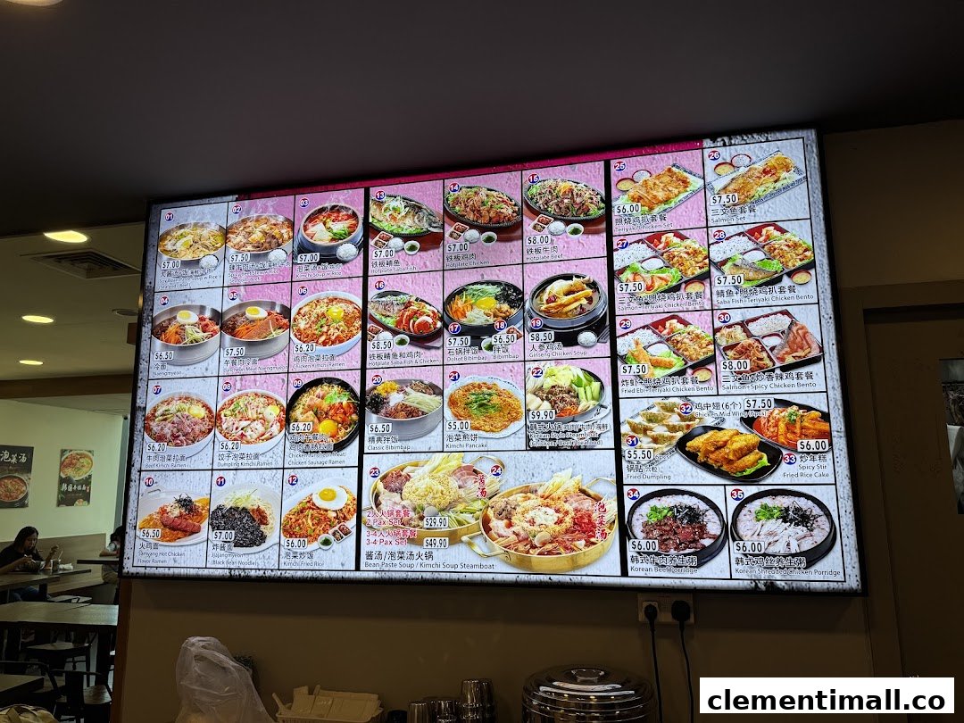 A brightly lit digital menu board showcasing a variety of Korean dishes with prices and images.