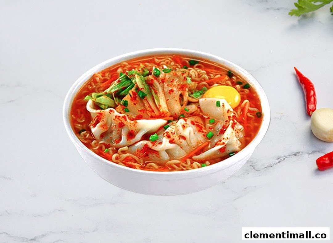 A vibrant bowl of Korean ramen with kimchi, dumplings, and an egg yolk, garnished with chili flakes.