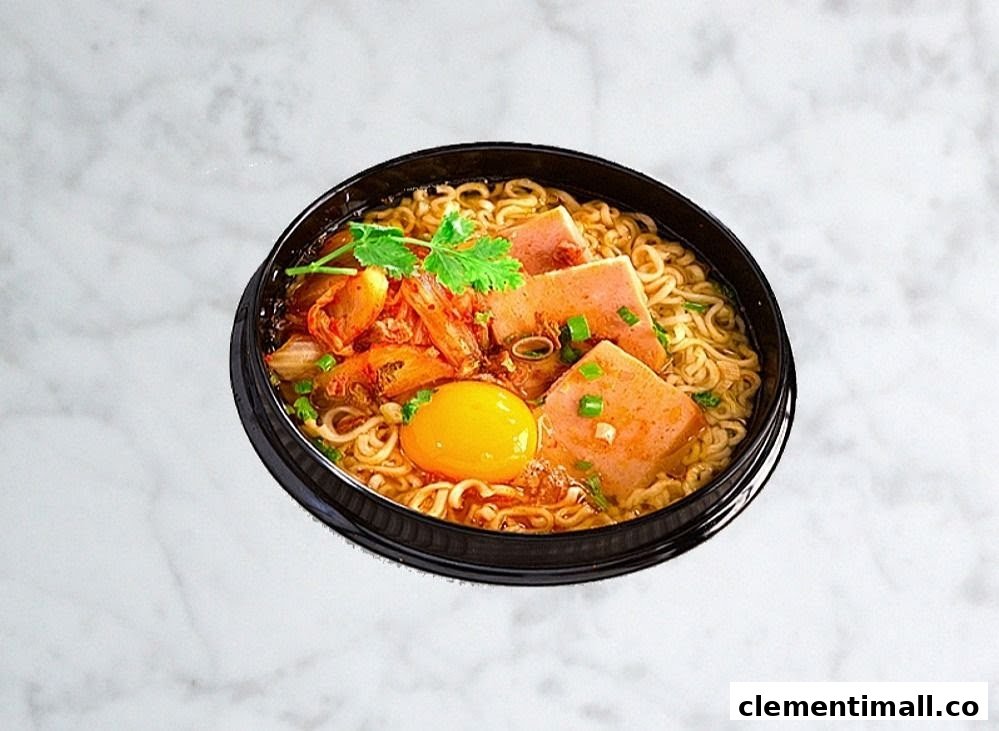 A vibrant bowl of Korean ramen with kimchi, spam, a raw egg yolk, and fresh herbs.
