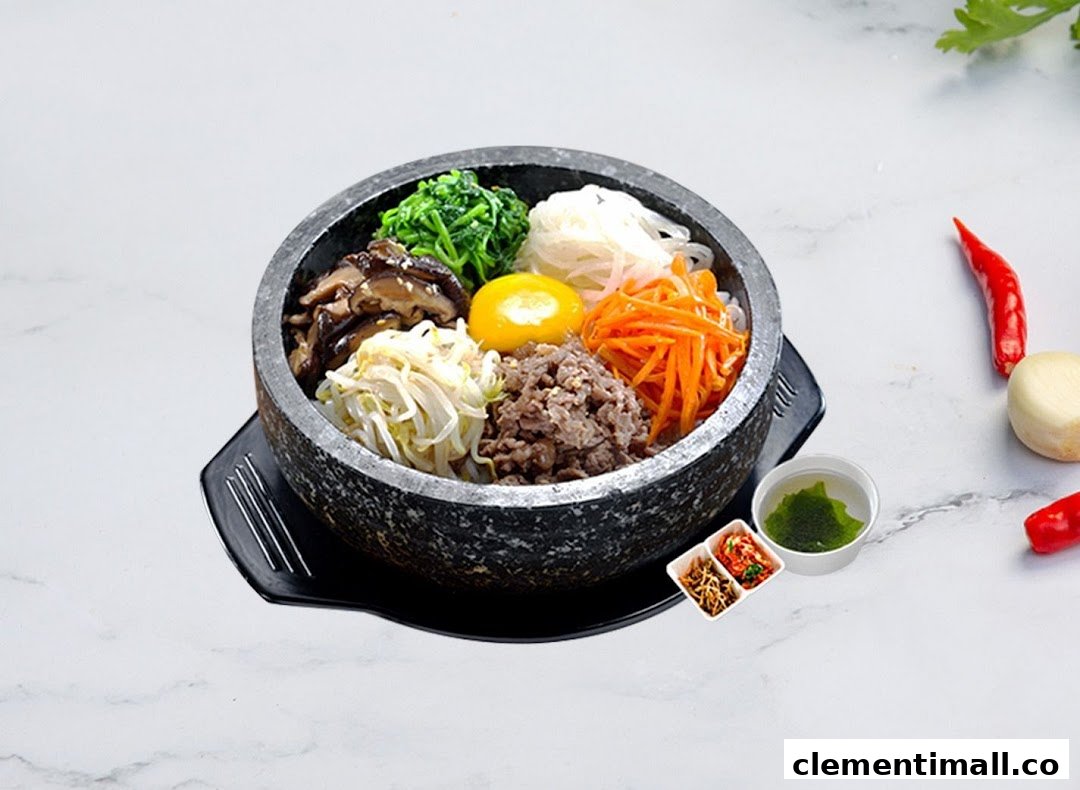 A vibrant Korean bibimbap dish served in a hot stone bowl with various toppings and side dishes.