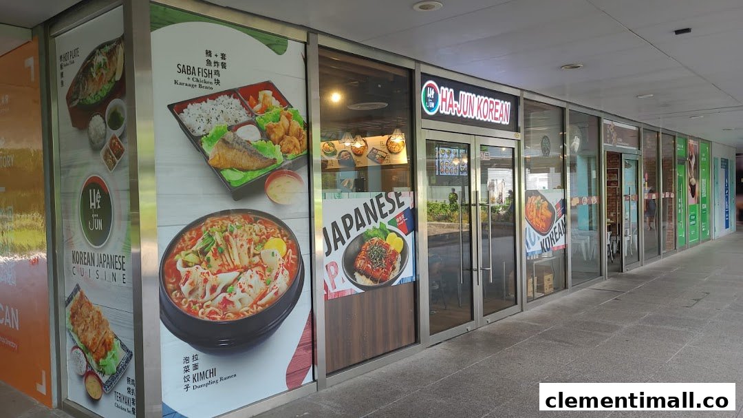 The shopfront of Ha-Jun Korean, featuring large window decals showcasing various Korean and Japanese dishes.