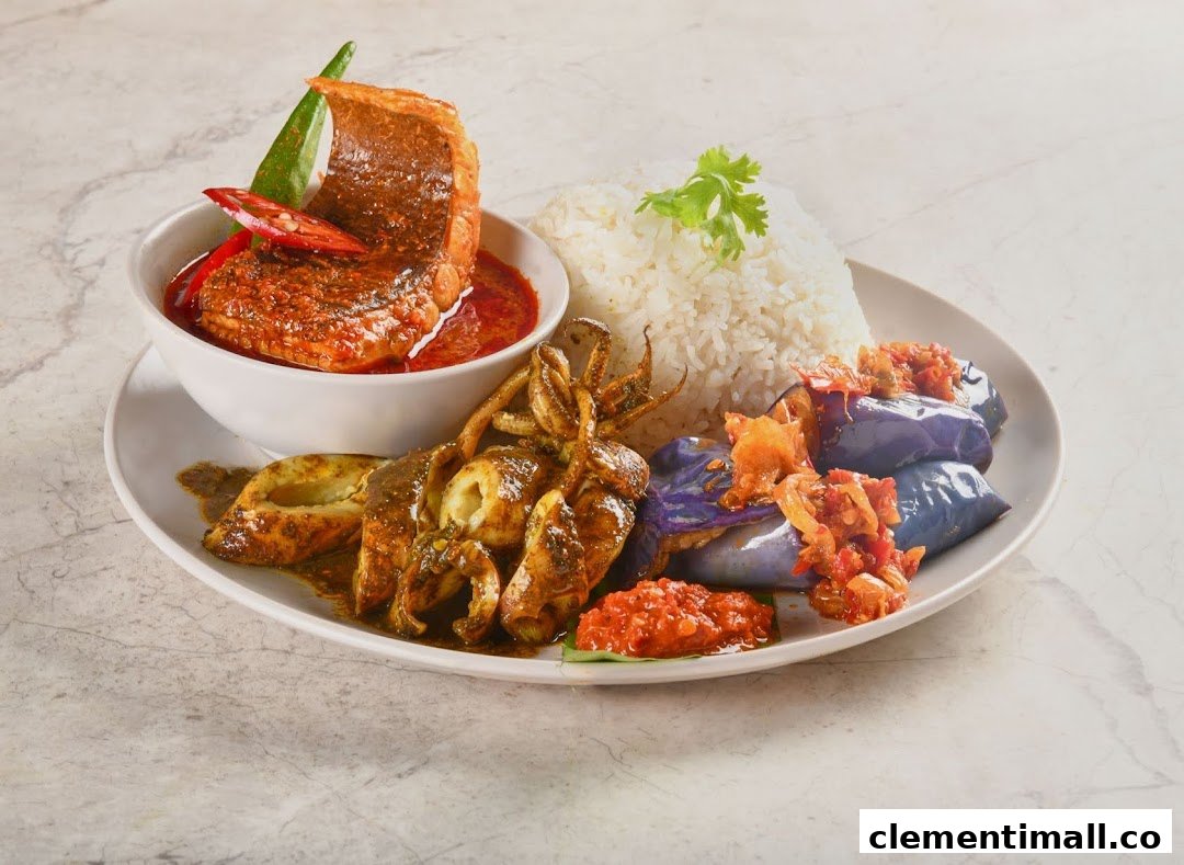 A vibrant plate featuring rice, fish curry, grilled squid, and eggplant with sambal, showcasing a traditional Malay meal.